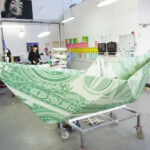<p><strong>Coating: Stainless steel sheet, folded, dollar look, sealed with clear coat</strong><br />
Kata Legrady, Dollar-Ship, 2013, 316x130x100 cm</p>
